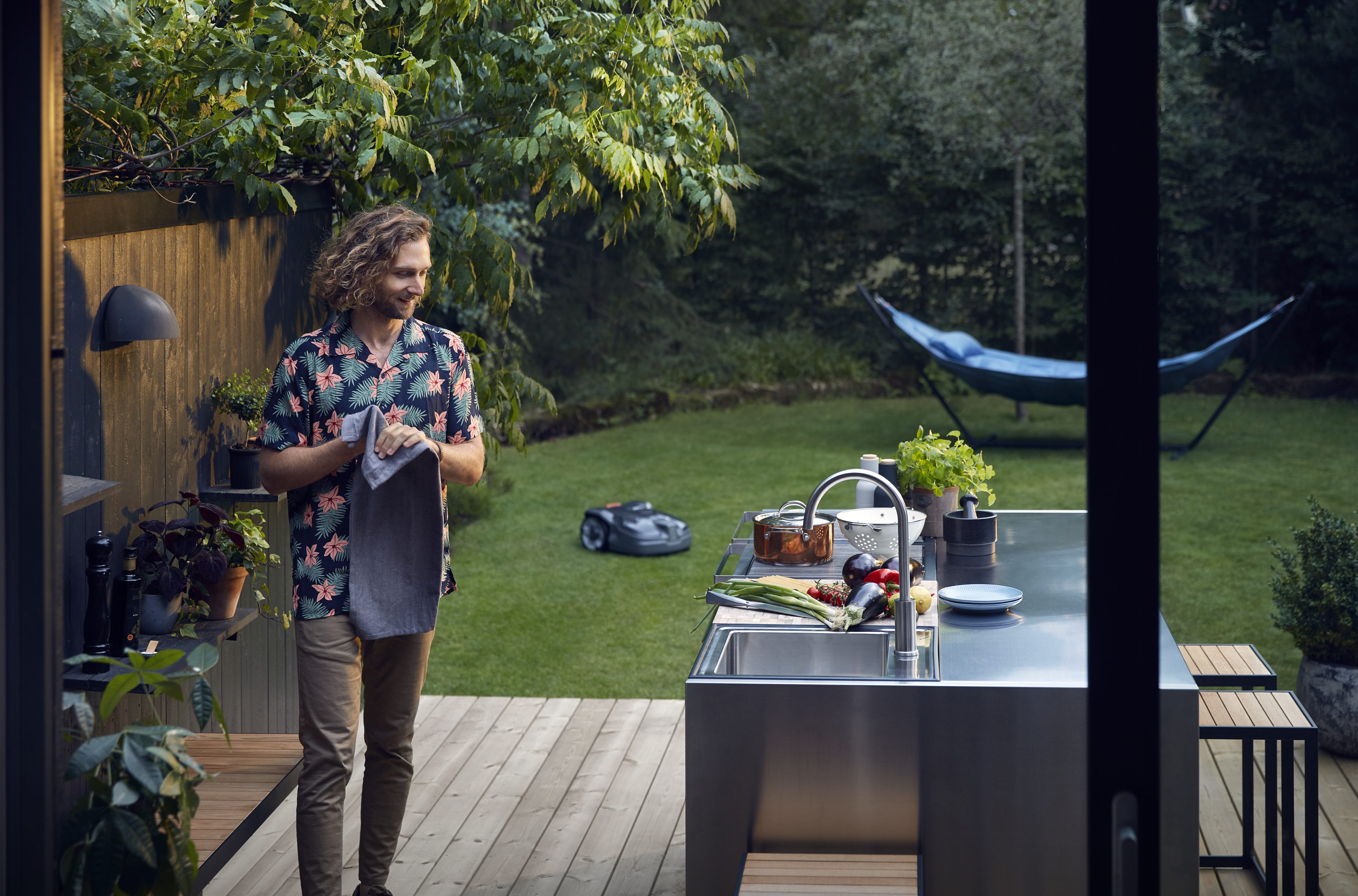Man and mower in garden